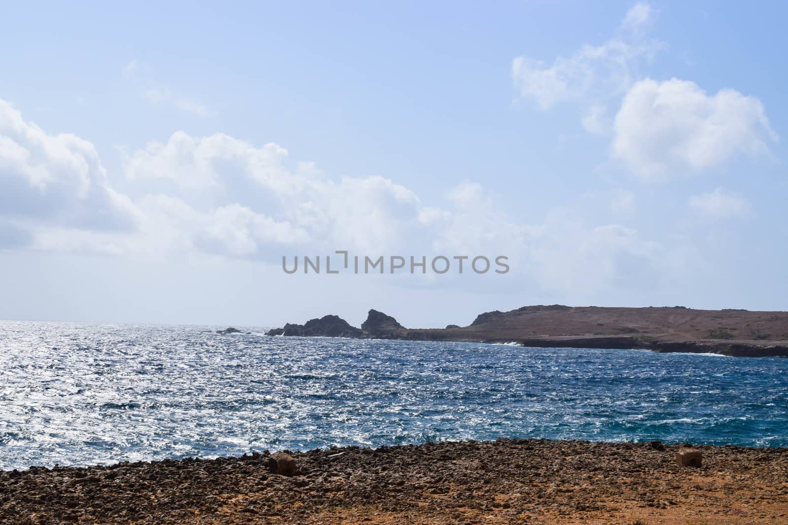 Arikok Natural Park on the island of Aruba in the Caribbean Sea with deserts and ocean waves on the rocky coast