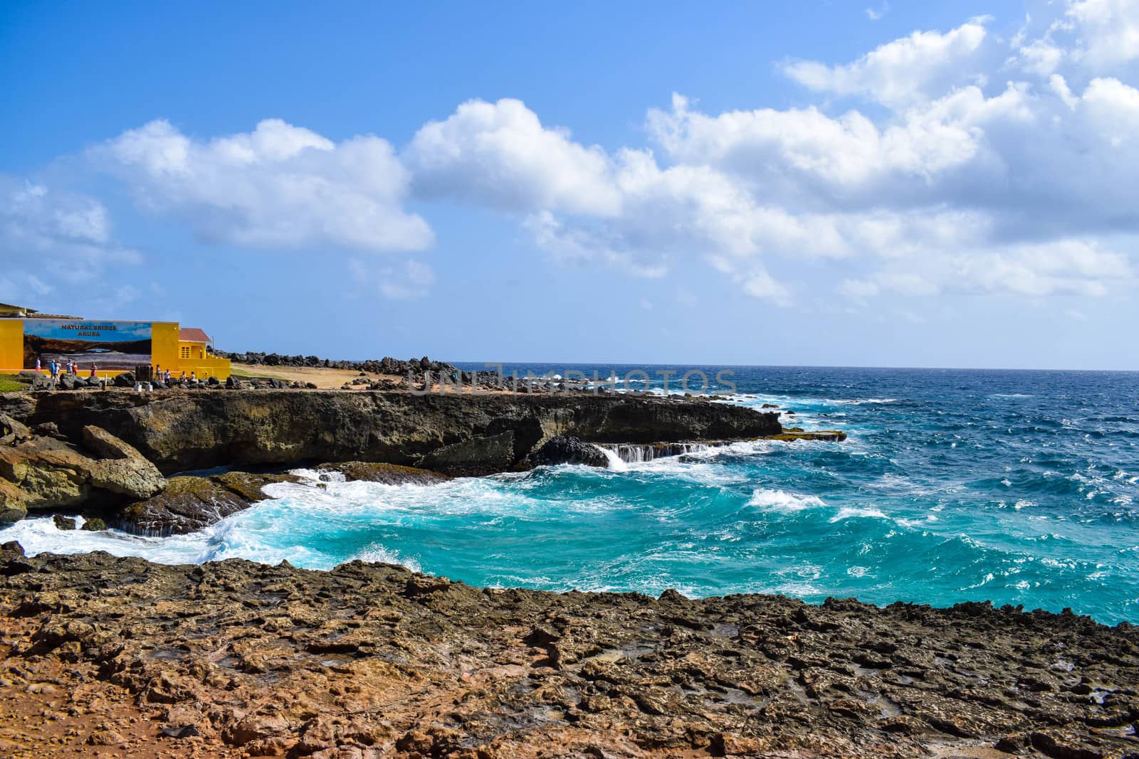 Arikok Natural Park on the island of Aruba in the Caribbean Sea with deserts and ocean waves on the rocky coast