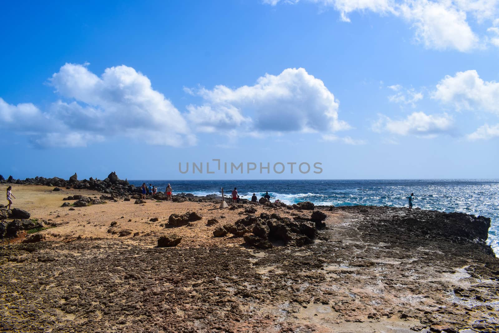 Arikok Natural Park on the island of Aruba in the Caribbean Sea with deserts and ocean waves on the rocky coast