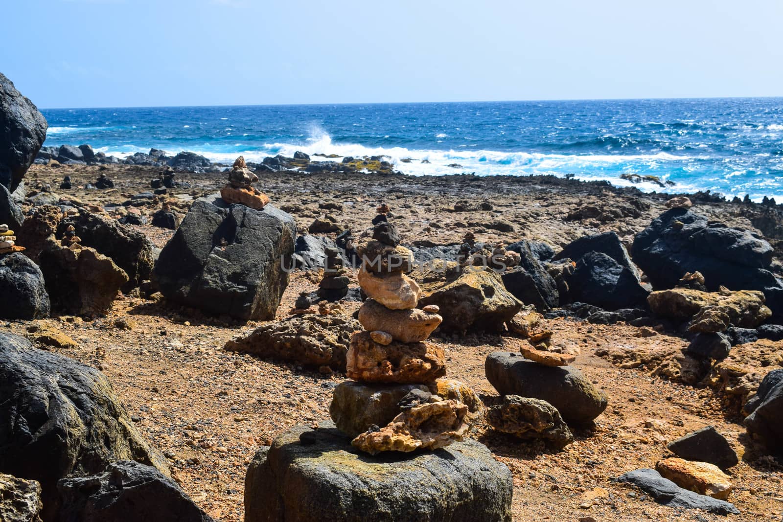 Arikok Natural Park on the island of Aruba in the Caribbean Sea with deserts and ocean waves on the rocky coast