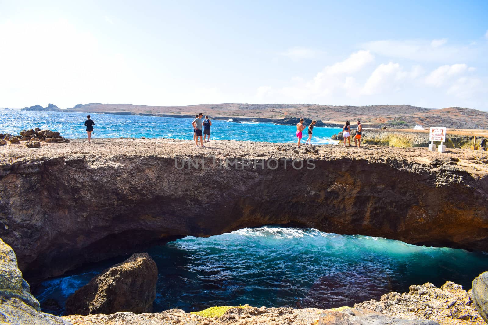 Arikok Natural Park on the island of Aruba in the Caribbean Sea with deserts and ocean waves on the rocky coast