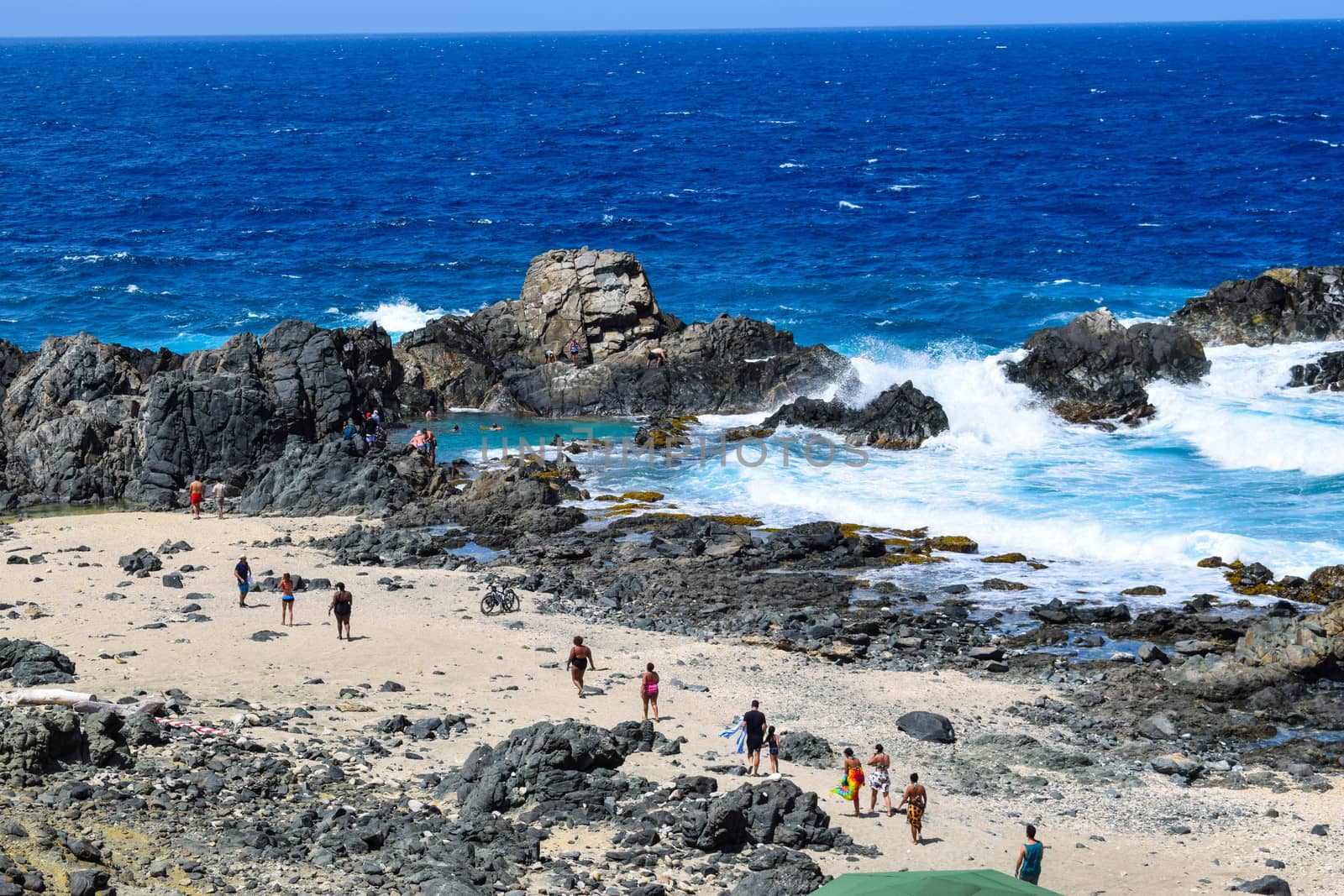 Arikok Natural Park on the island of Aruba in the Caribbean Sea with deserts and ocean waves on the rocky coast