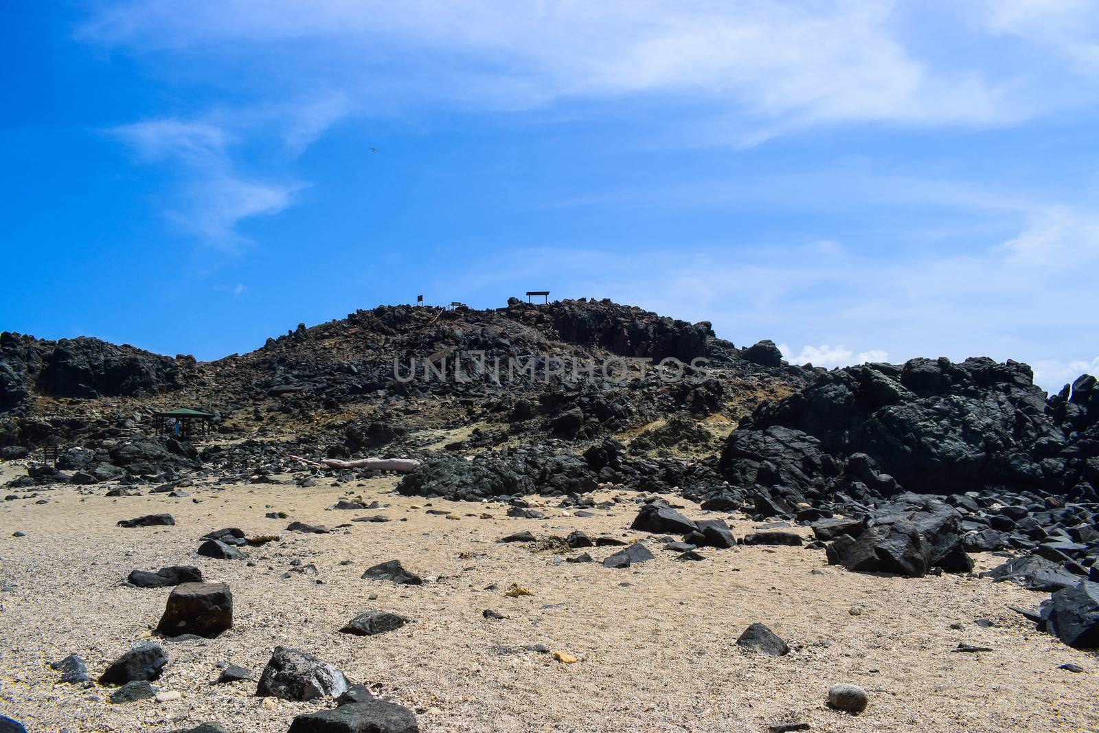 Arikok Natural Park on the island of Aruba in the Caribbean Sea with deserts and ocean waves on the rocky coast