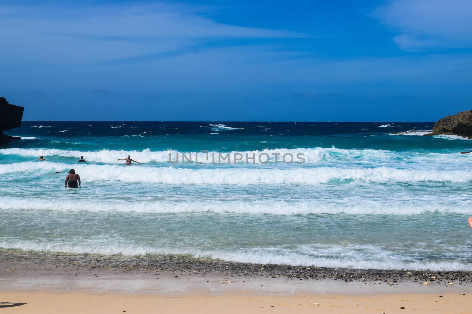 Arikok Natural Park on the island of Aruba in the Caribbean Sea with deserts and ocean waves on the rocky coast