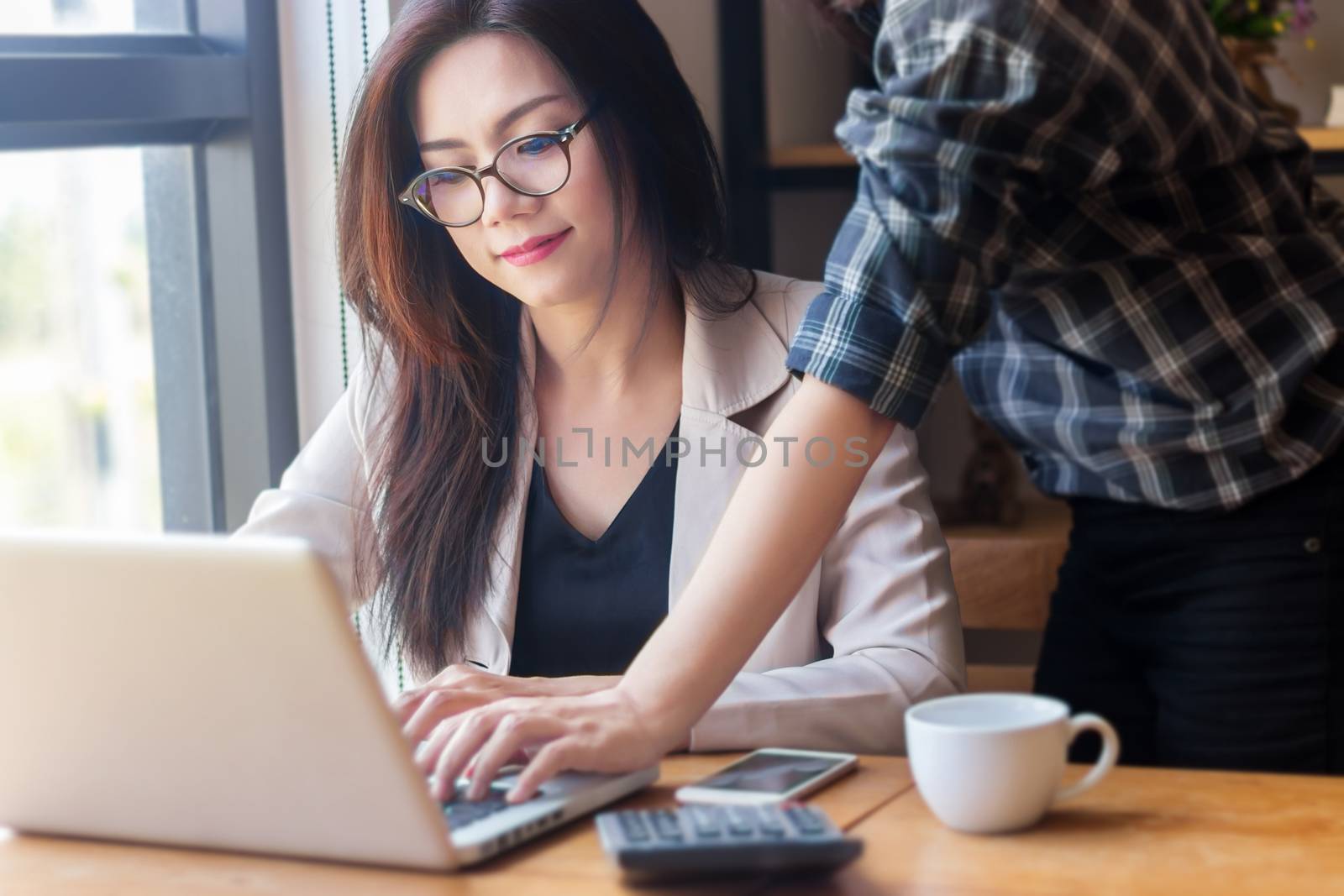 training for trainee about business development in startup company concept. Asian business staff people training in office to teaching on computer and discuss project.