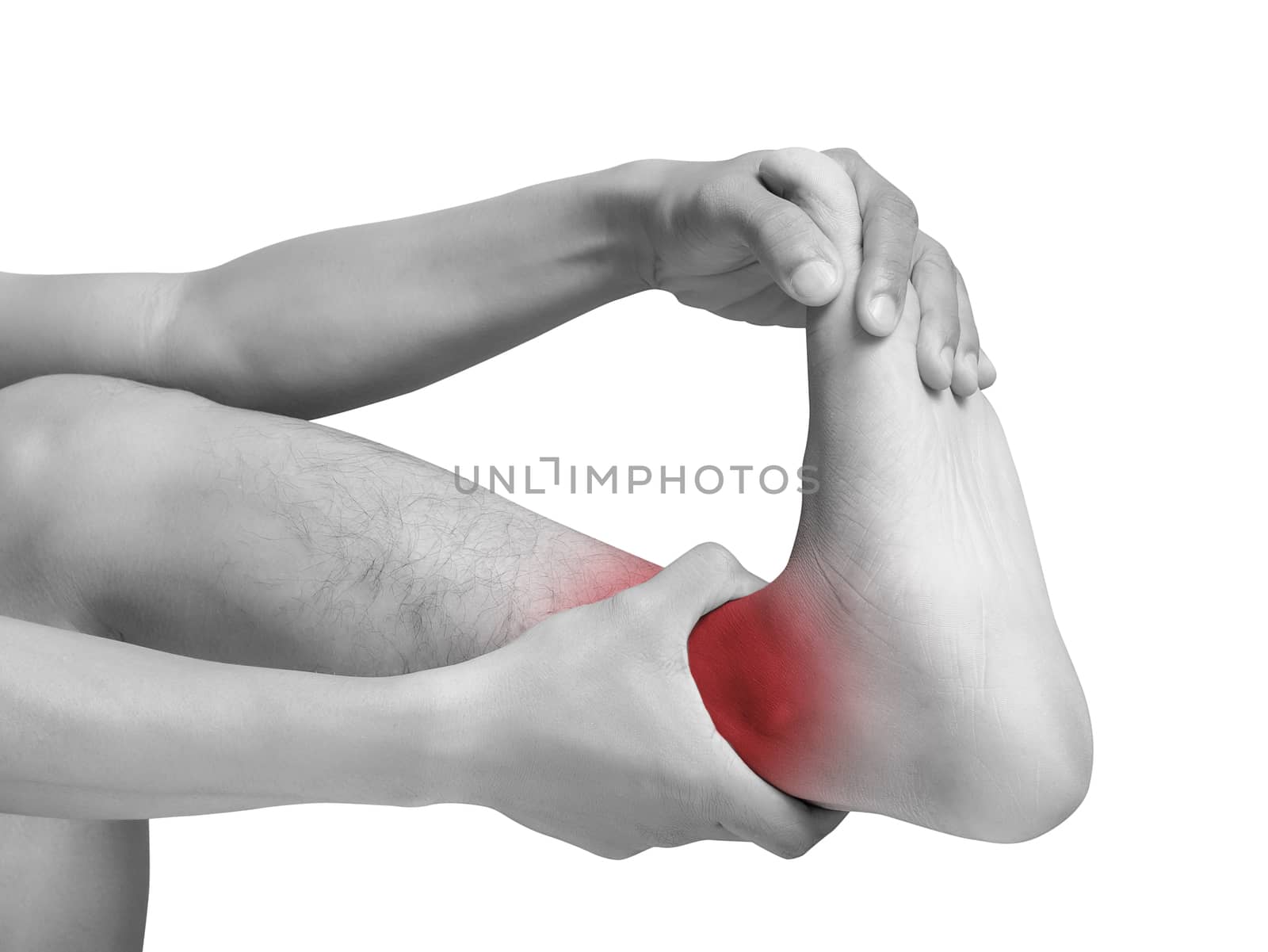 man suffering from cramp using hand massage painful foot and ankle. mono tone color with red highlight at ankle , ankle muscles isolated on white background. health care ,medical concept. studio shot by asiandelight