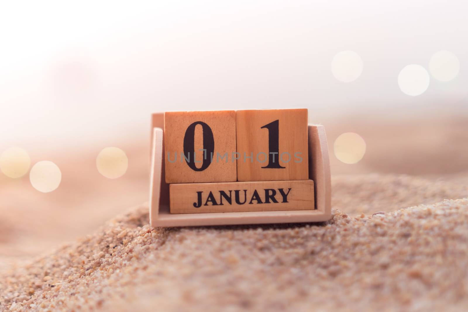 Wood brick block show date and month calendar of 1st January or New year day. by Suwant