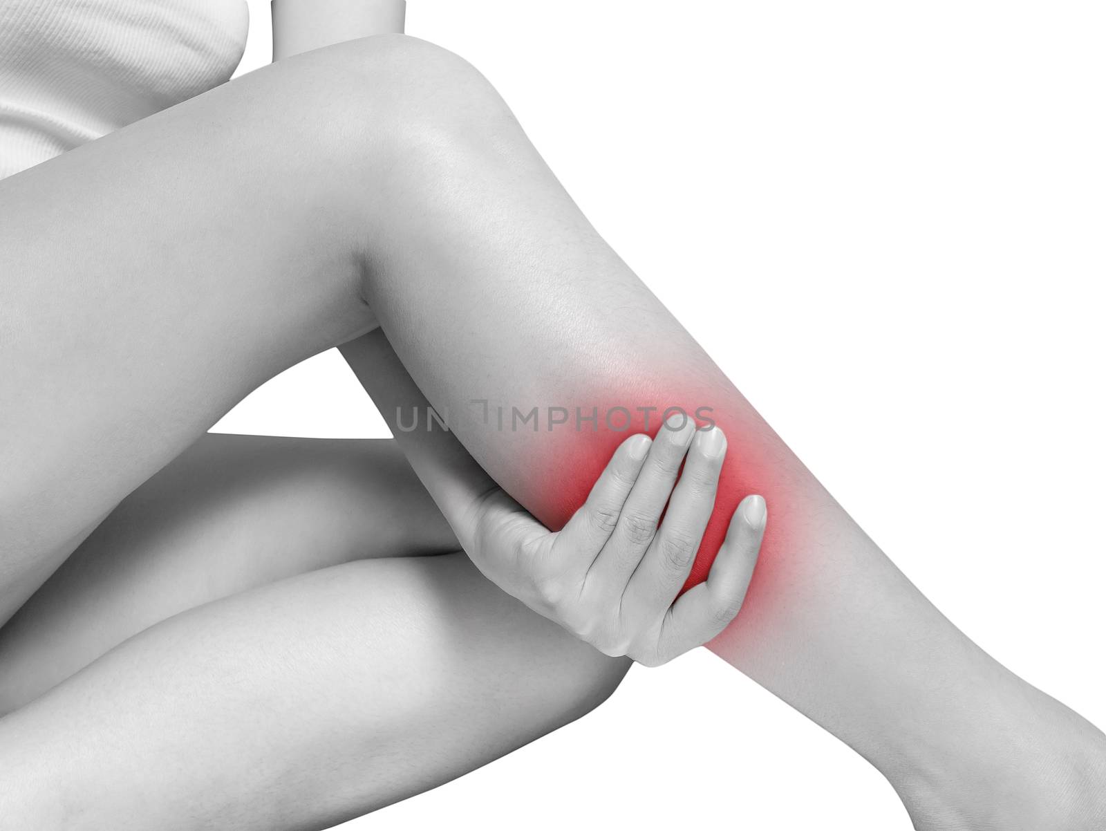 woman suffering from leg pain, calf pain. mono tone highlight at calf, leg isolated on white background. health care and medical concept