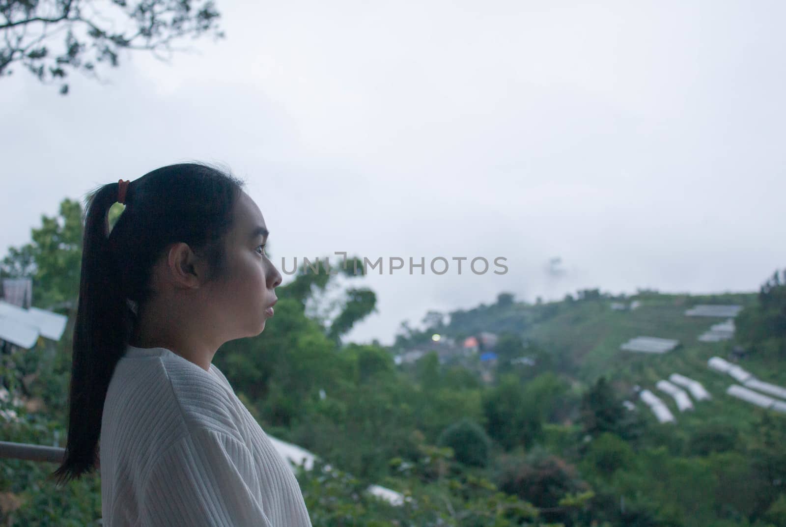 Asian young woman looking view at Ang Khang mountain, Fang Chiang Mai. Tourist attraction in northern of Thailand.