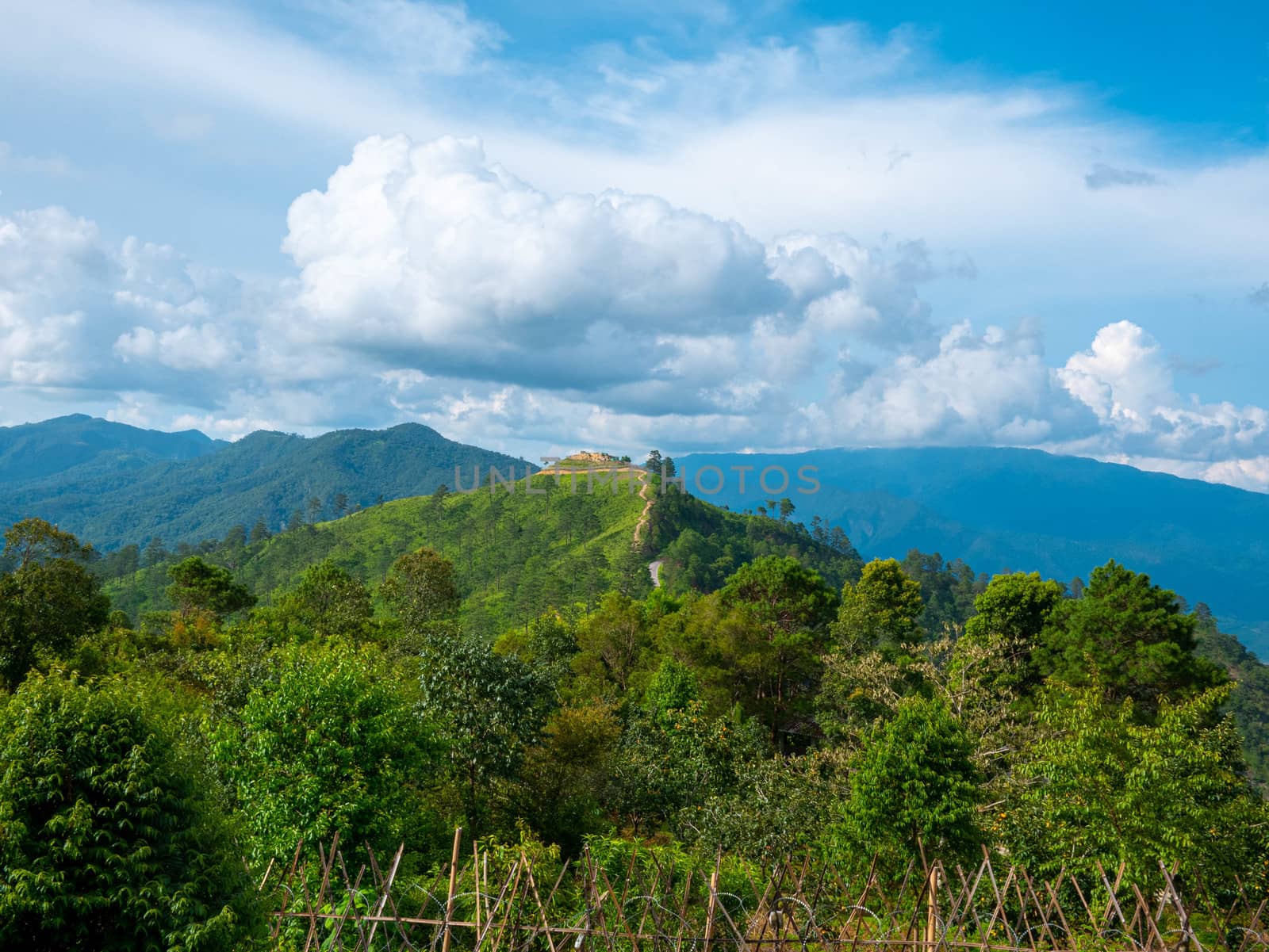 Landscape view of complex mountain with clear sky in the morning by TEERASAK