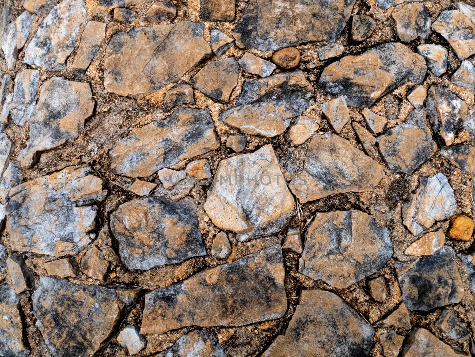 Close-up texture of stone walkway with cracked. Exterior design  by TEERASAK