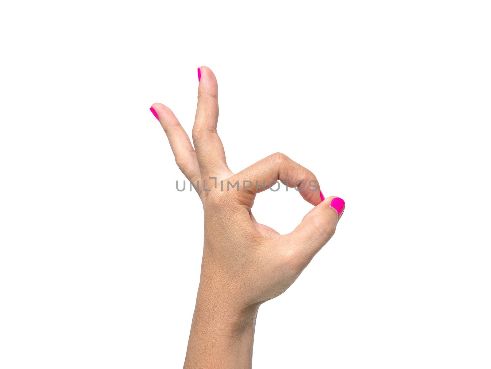 Close-up of a woman's hand showing OK sign with a pink nail polish isolated on a white background. by TEERASAK