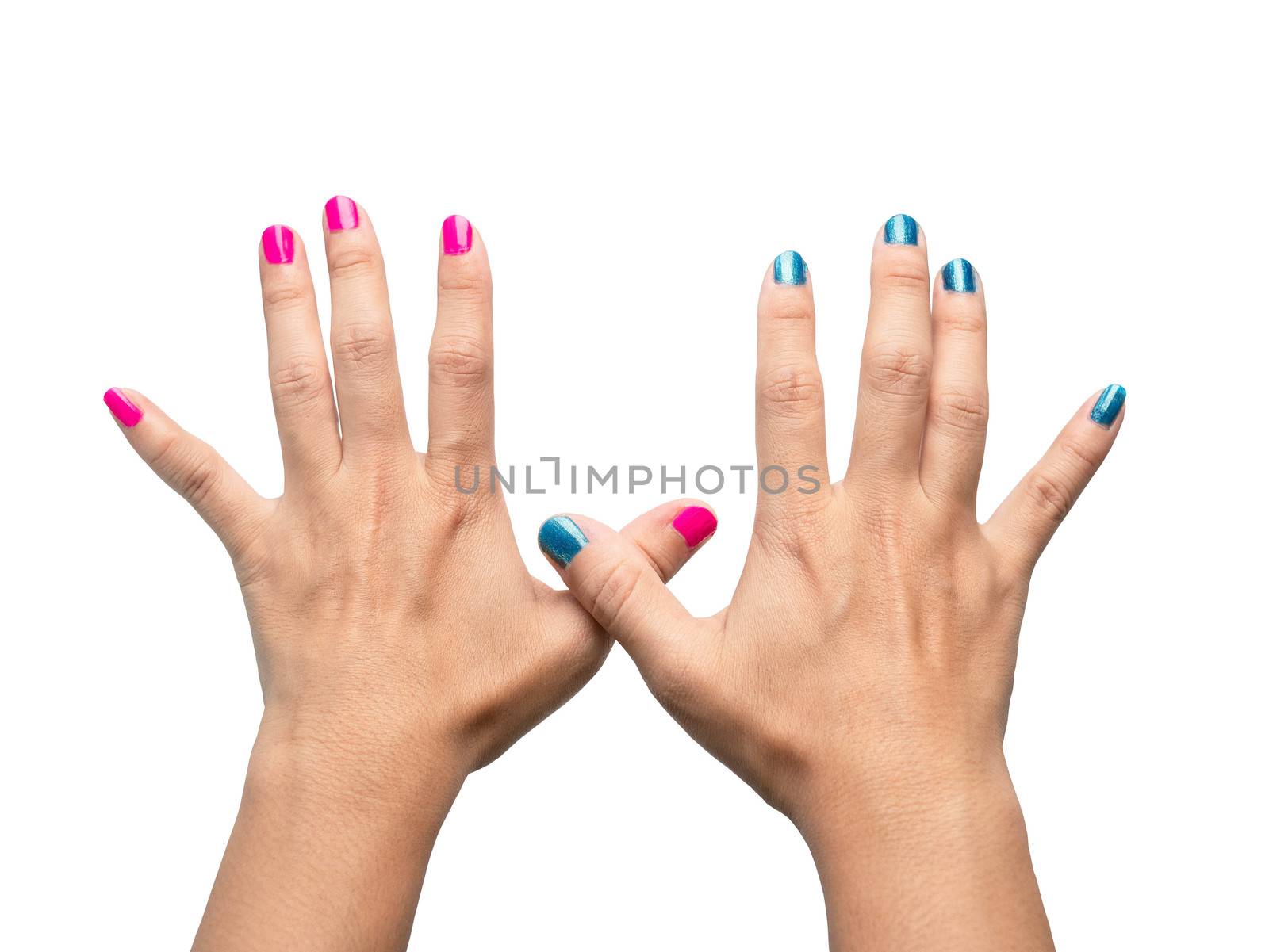 Close-up Hands of beautiful female with paint pink and blue nails on white background. by TEERASAK