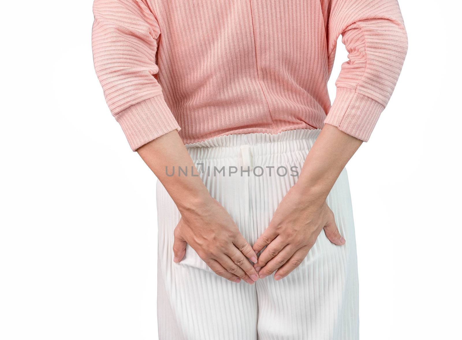 Woman suffering from hemorrhoids and hand holding her bottom. Health care concept.