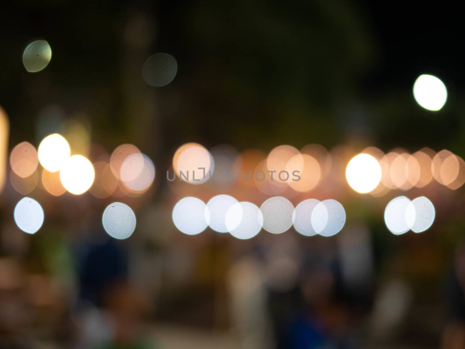 Abstract bokeh background of light from Thai lanna lantern at night.  Concepts of celebration in Yi Peng Festival. by TEERASAK