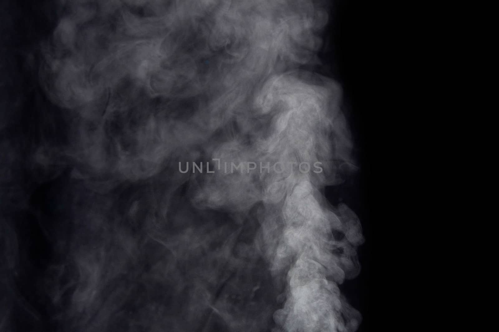 White smoke on dark background.