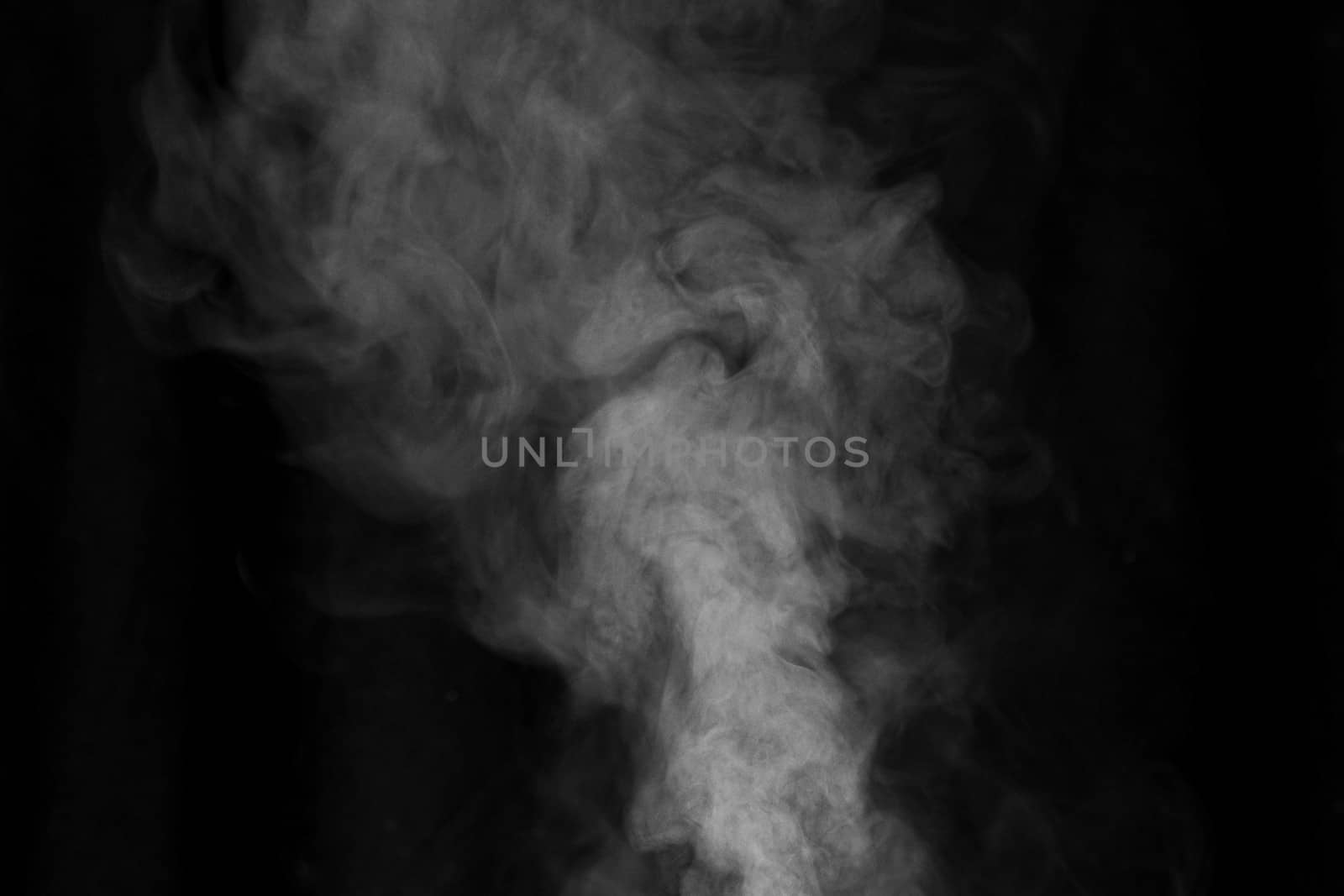 White smoke on dark background.