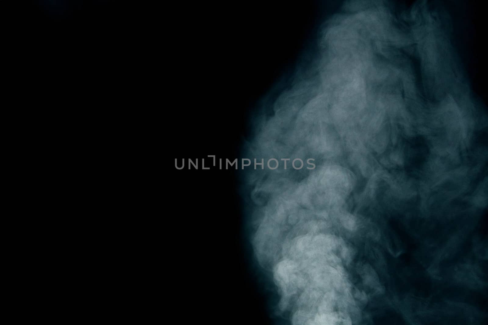 White smoke on dark background.