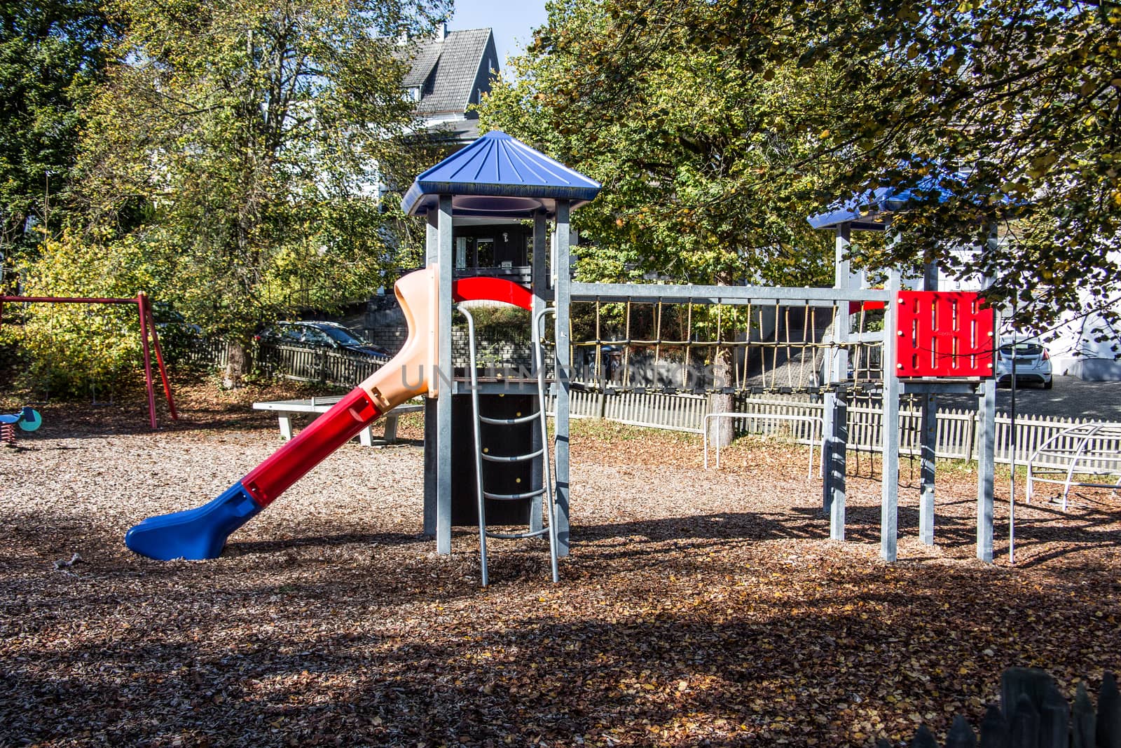 Slide and climbing tower on adventure playground