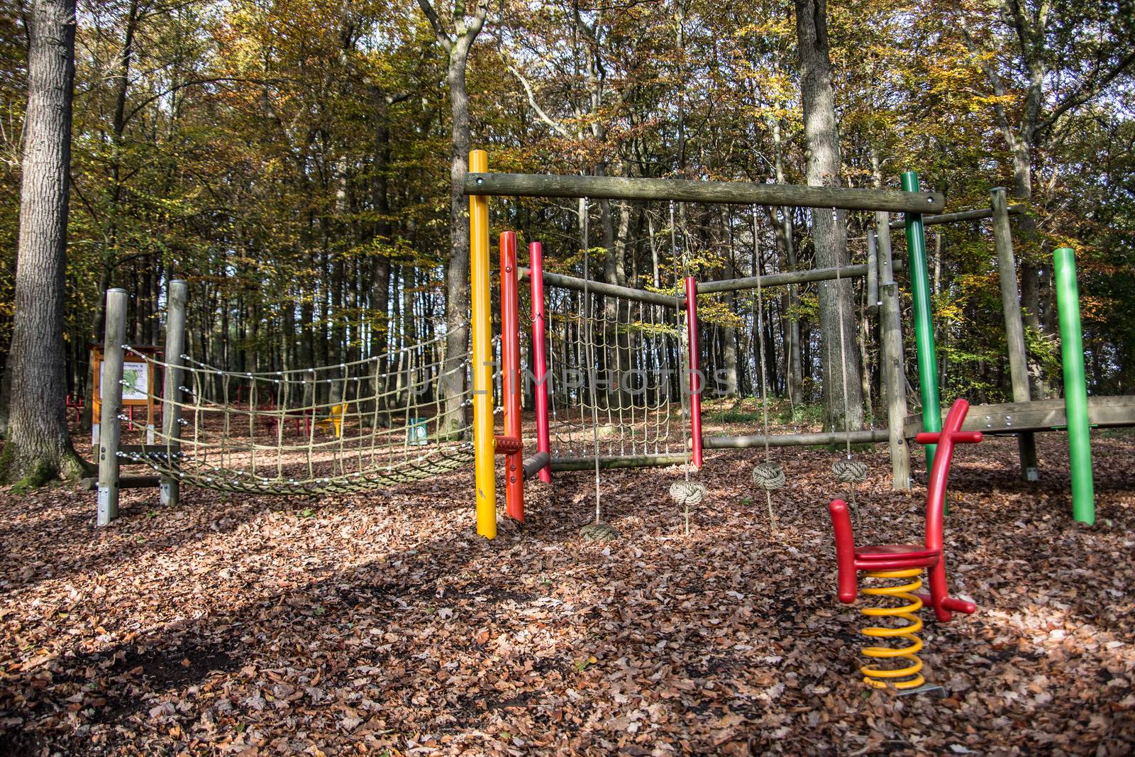 Children's playground with sports equipment in the deciduous for by Dr-Lange