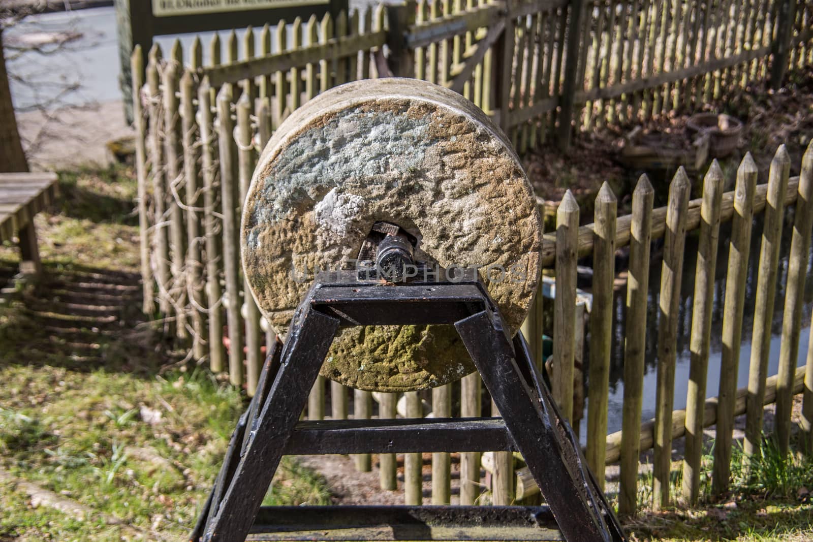 old grindstone in the garden by Dr-Lange
