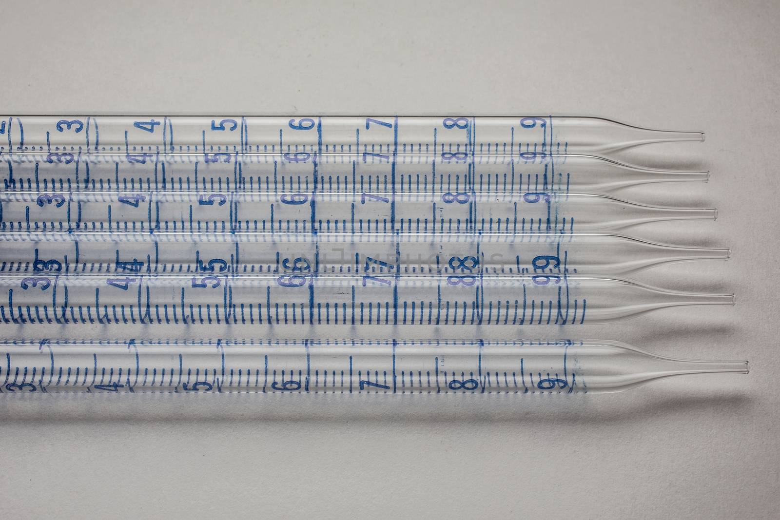 Glass pipettes in the laboratory with scale