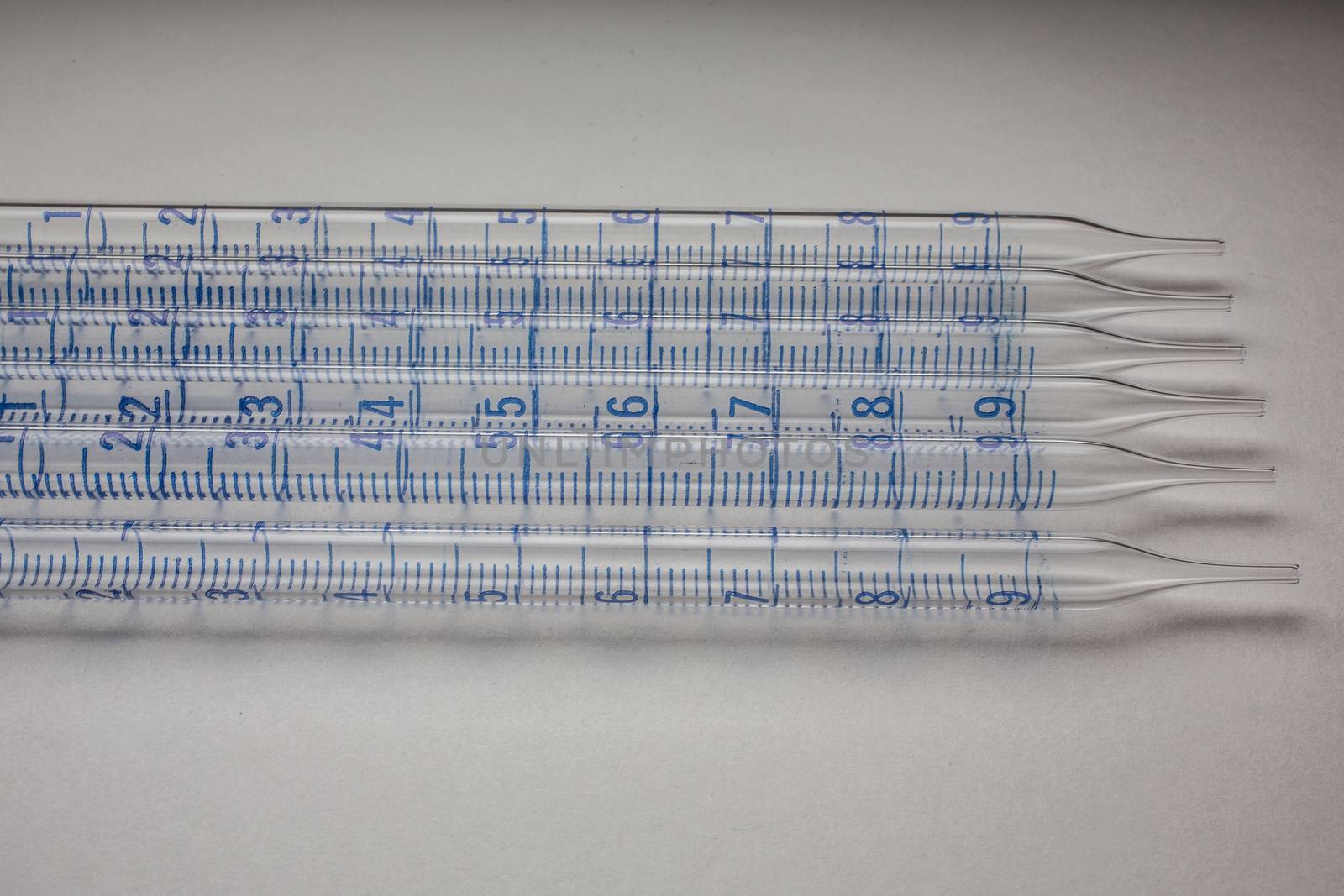Glass pipettes in the laboratory with scale by Dr-Lange