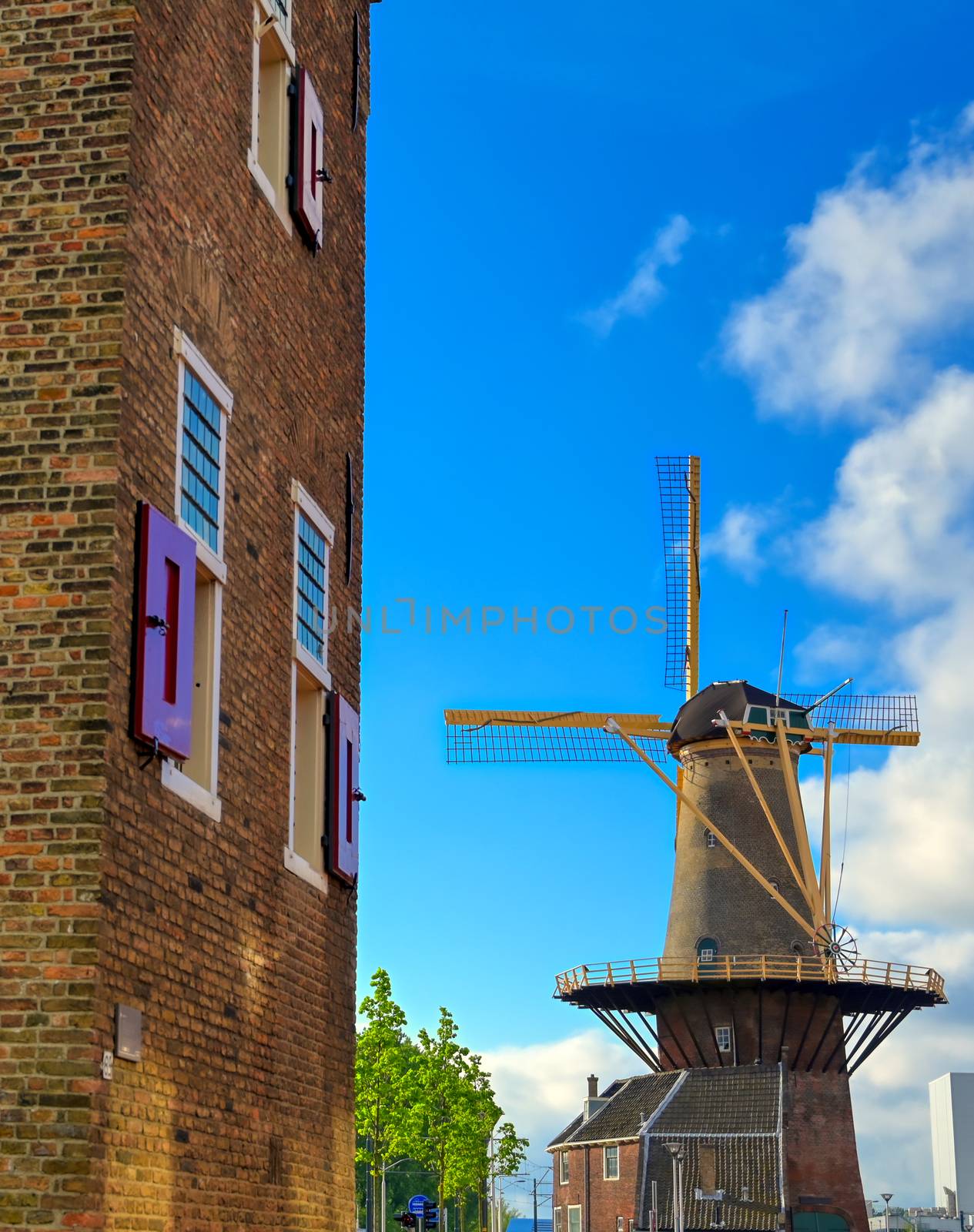 A windmill in the city of Delft in The Netherlands on a sunny day.