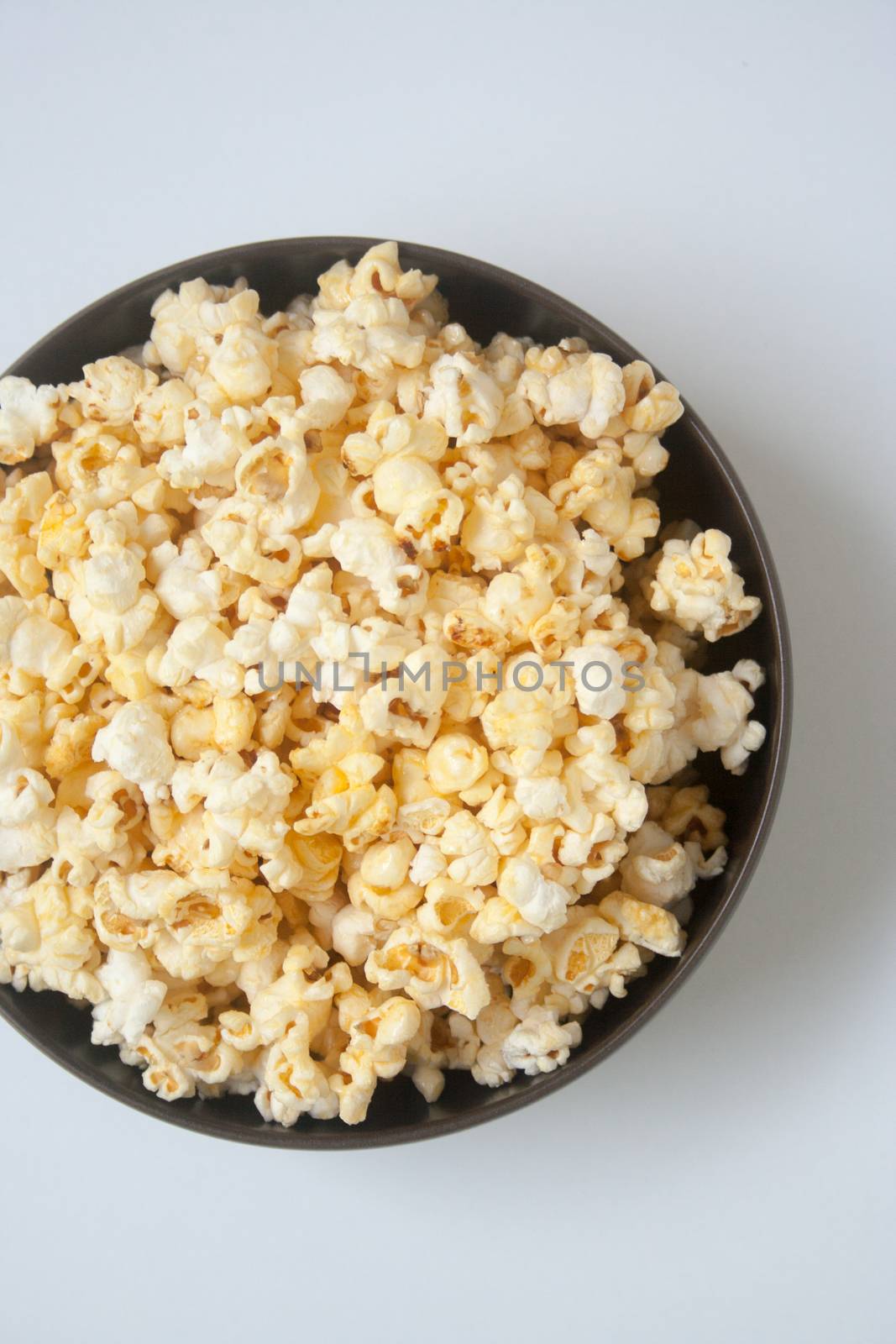 A large bowl of popcorn with butter flavor for movie tonight.