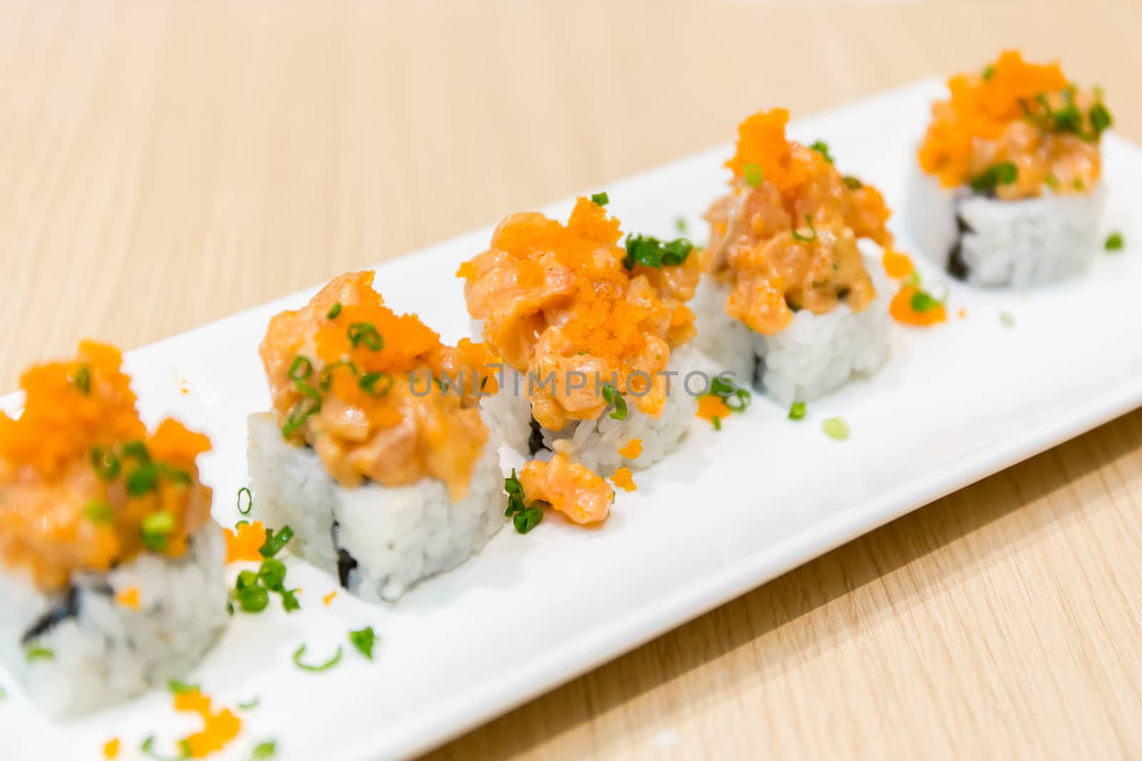 Plate of freshly cooked salmon sushi.