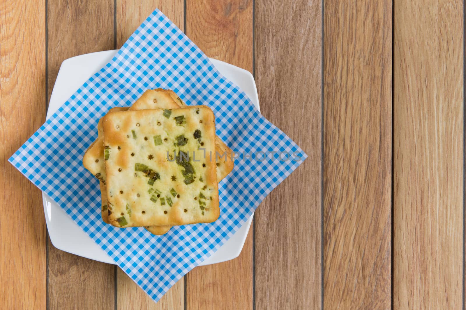 Stack of salty vegetable flavored crackers.