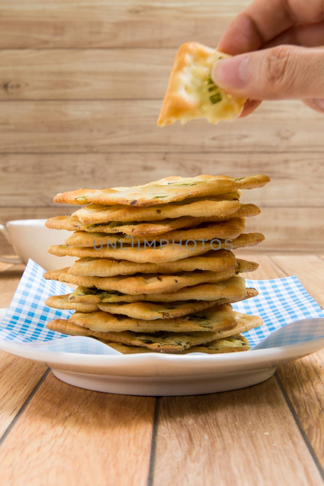 Stack of salty vegetable flavored crackers.