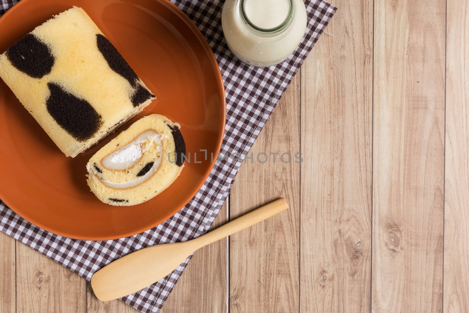 Cake roll with cow-skin pattern inserted with fresh milk cream.