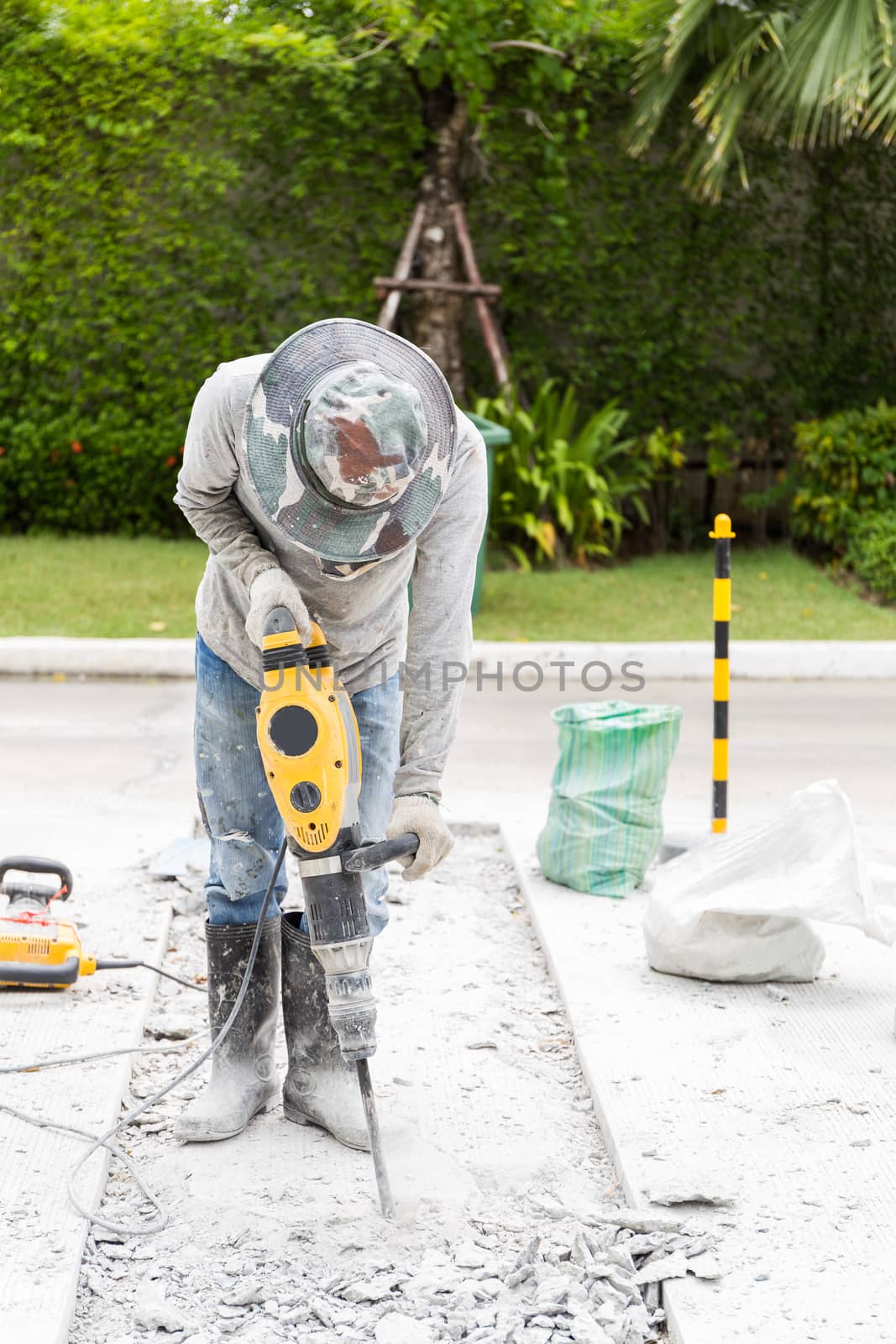 Ongoing roadwork under construction using jackhammer equipment
