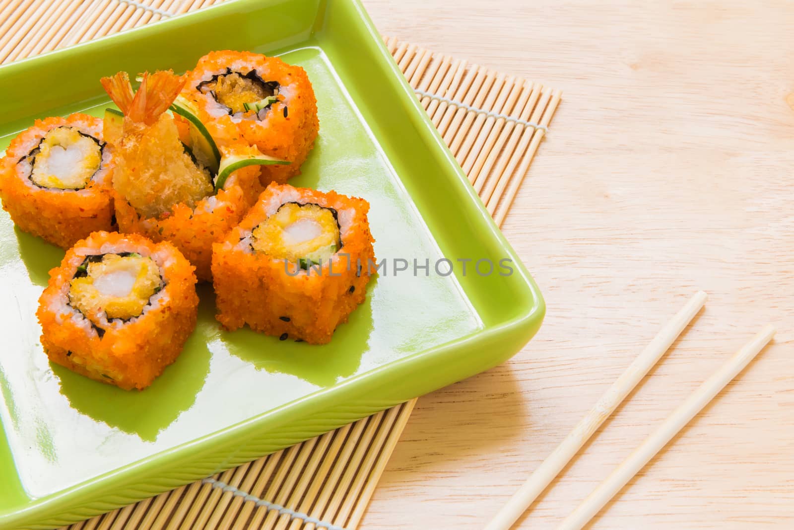 Traditional Japanese food, sushi roll, on wooden background