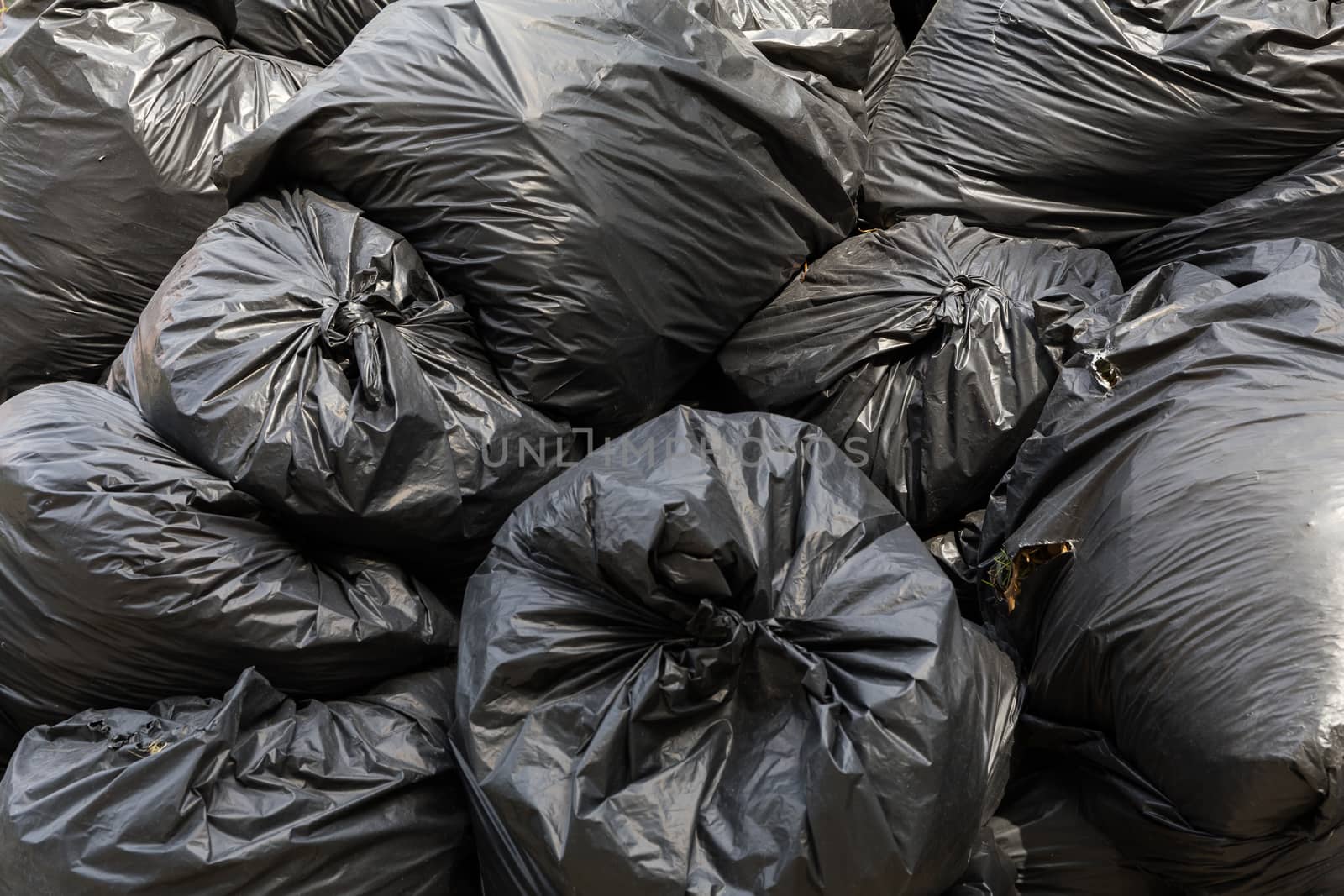 Big Stack of Black Garbage Bags
