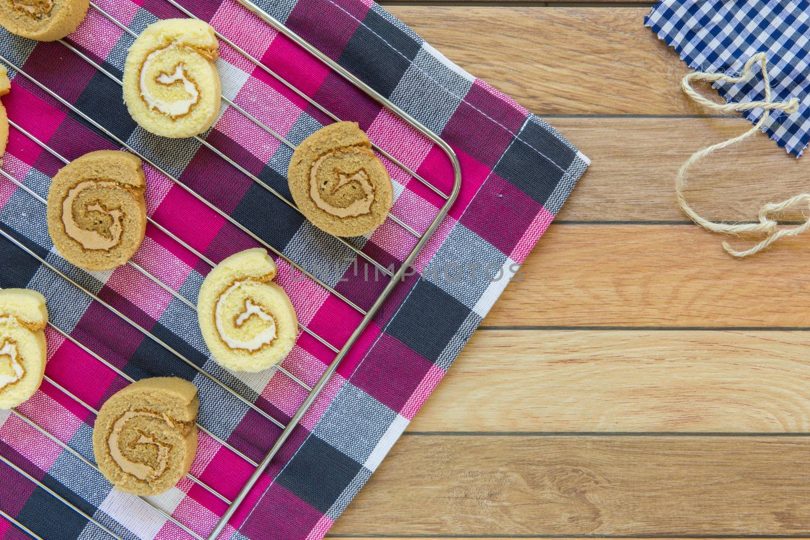 Freshly made slices of vanilla and coffee cake rolls.