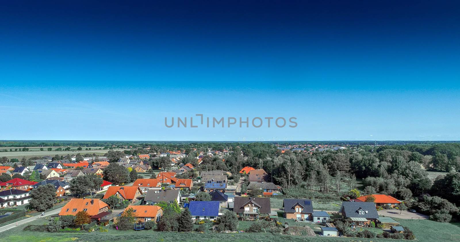 Aerial photo with the drone, anew build-up plot with single houses and gardens, narrow neighborhood