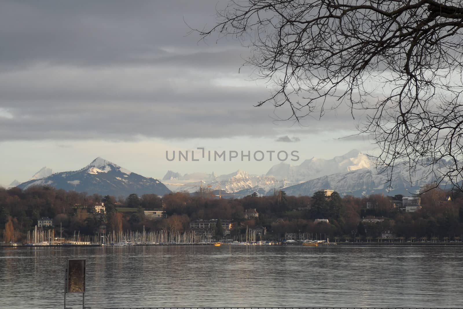 Geneva, Switzerland - Classical view of the famous water fountain of Geneva lake, the symbol of Geneva. Beautiful romantic scenery of Swiss city.