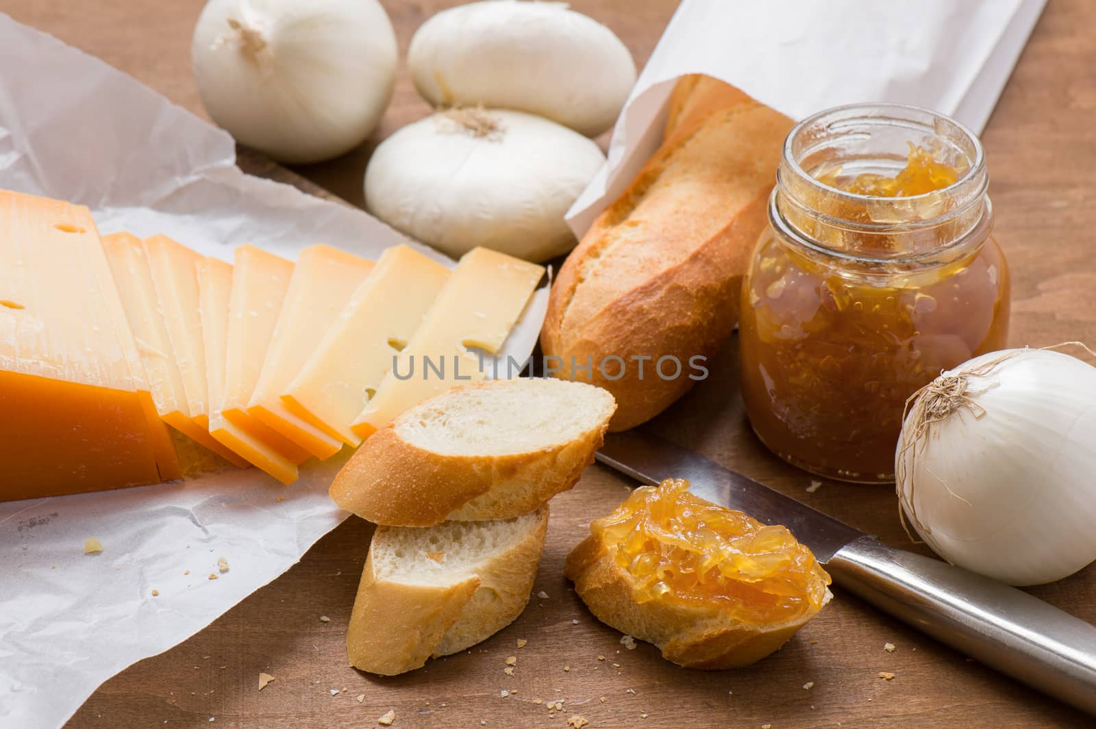 Onion marmalade on bread with sliced ​​cheese