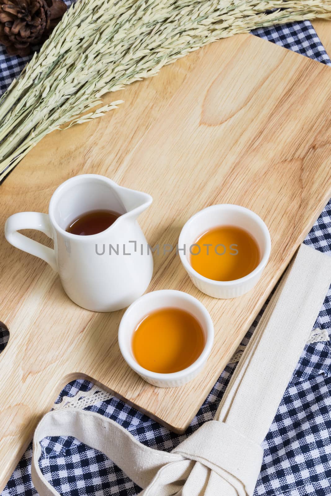Wood Texture Cutting Plate and Cups of Tea on Table at Home