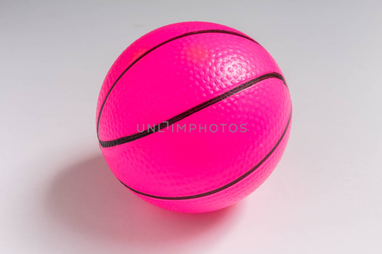 Isolated Pink Plastic Ball on White Background