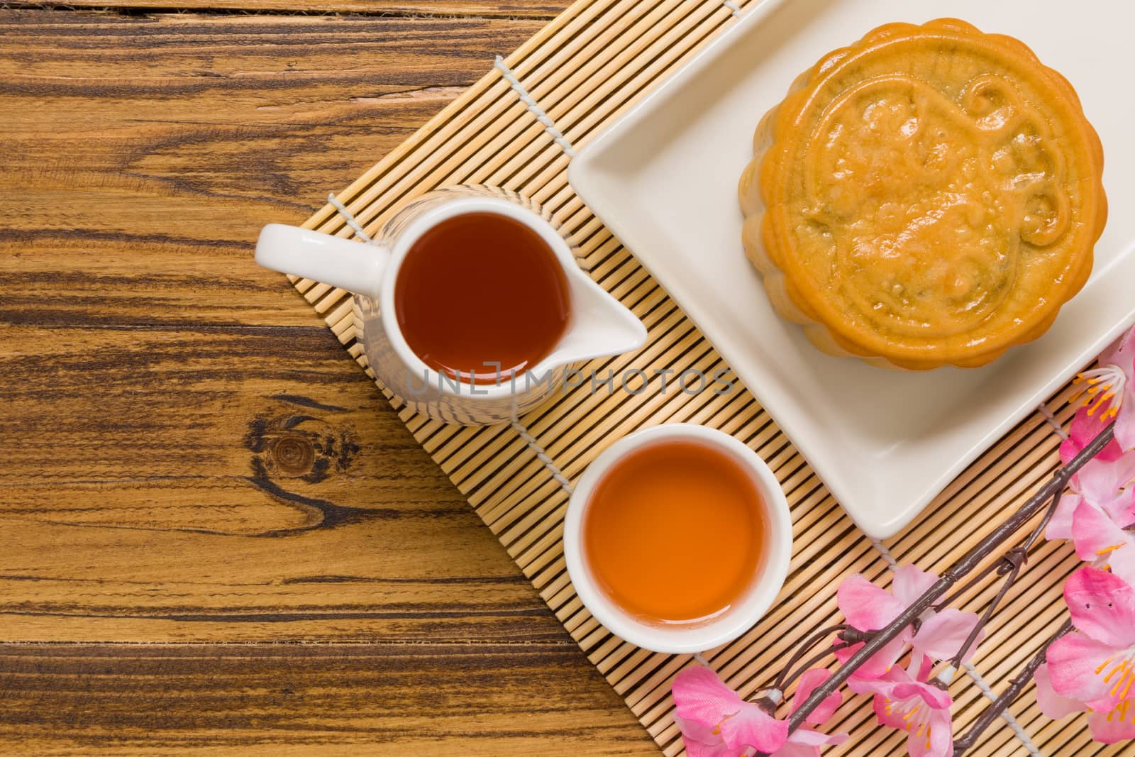 Traditional Chinese mooncake eaten with hot tea for relaxing time.