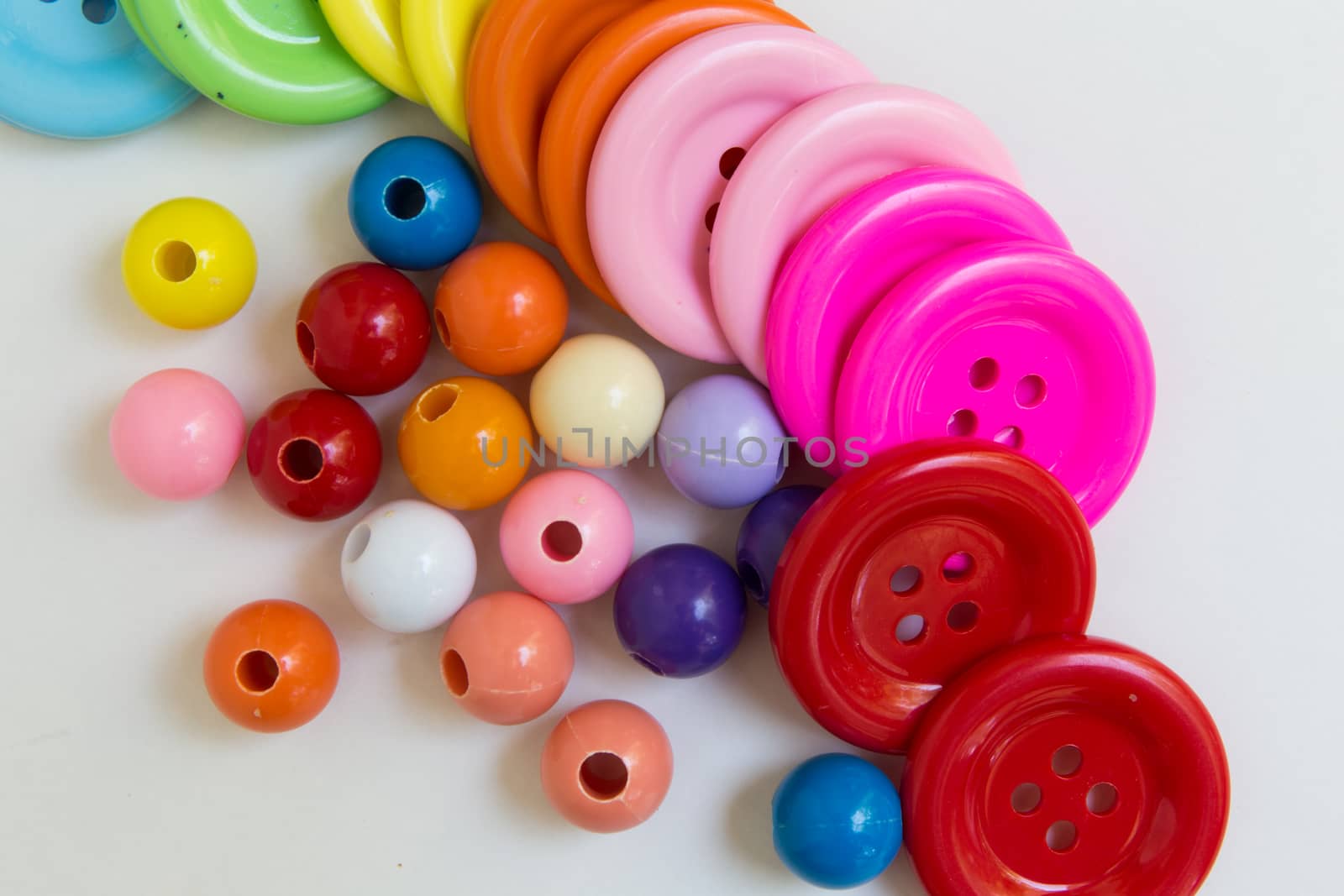 These colorful buttons and beads are for kids to practice their sewing skill.