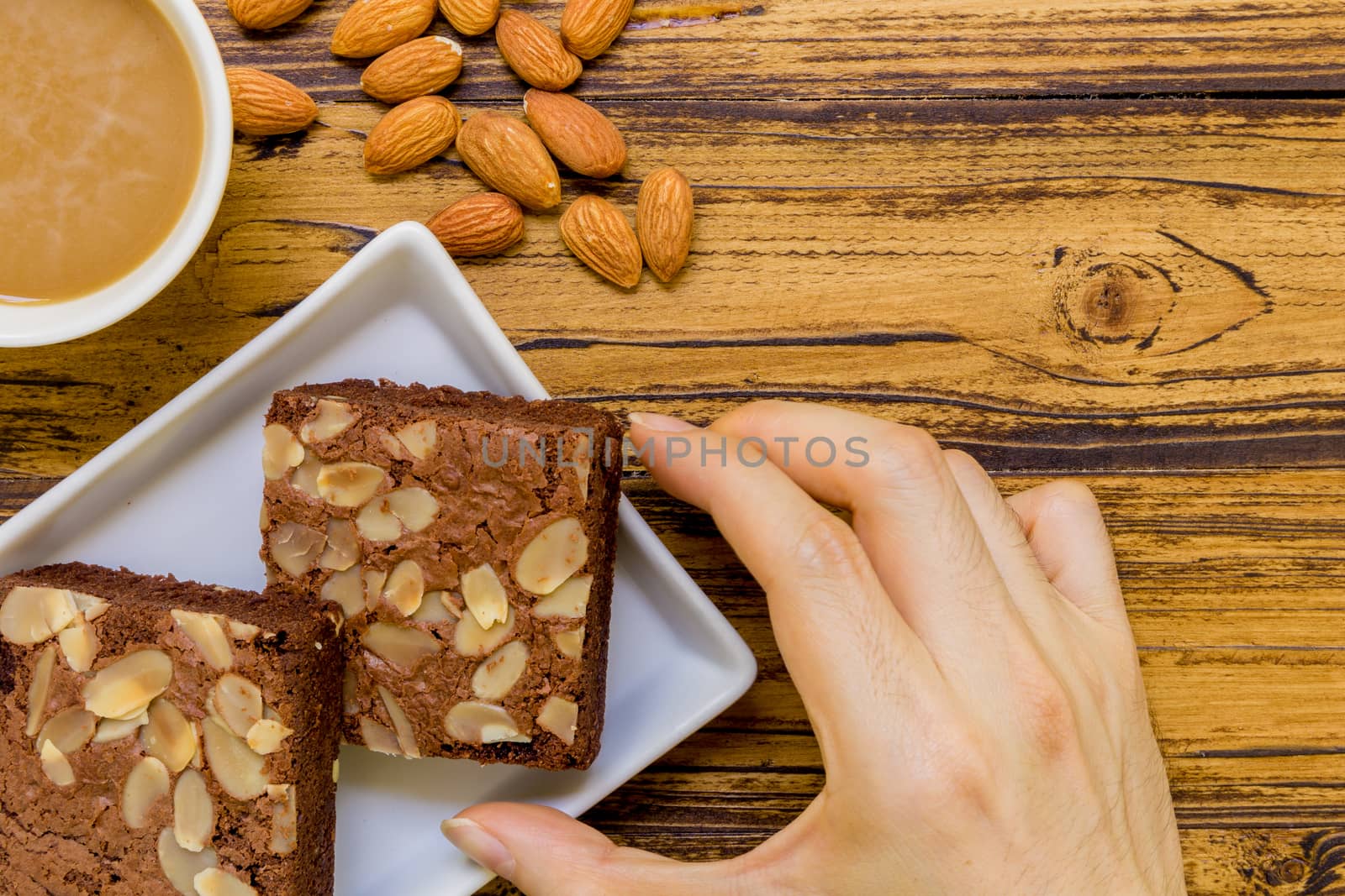 Chocolate almond brownie for relaxing coffee break.