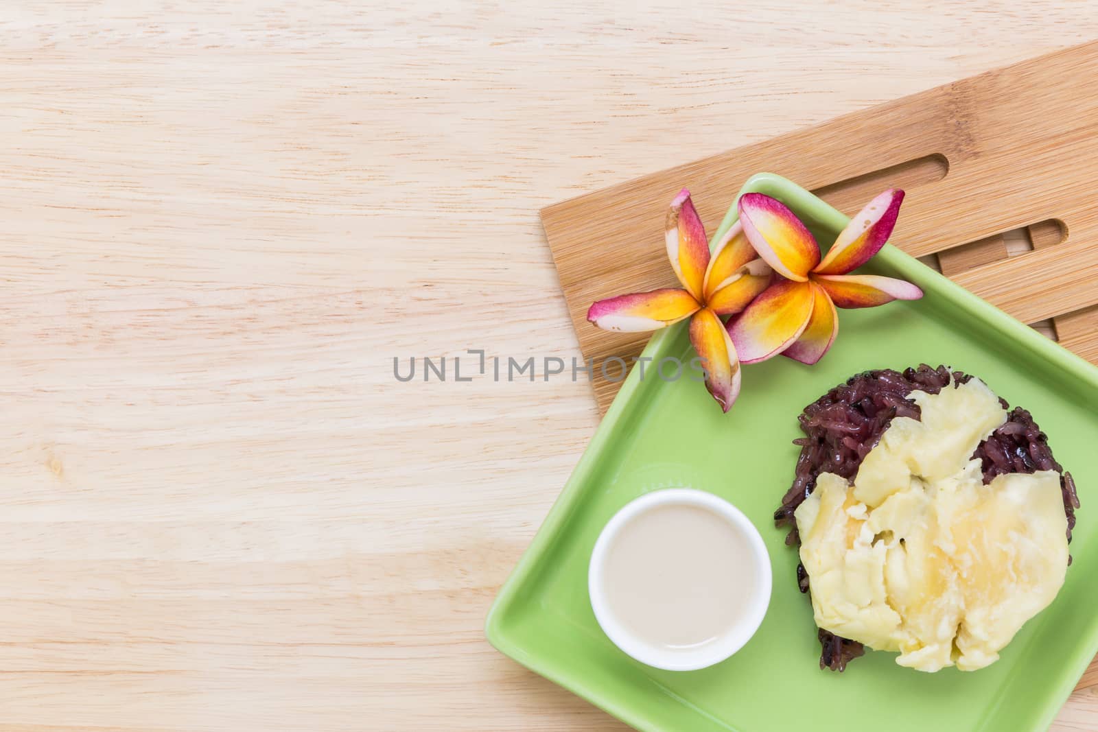 Durian with sticky rice is famous traditional Thai dessert menu.