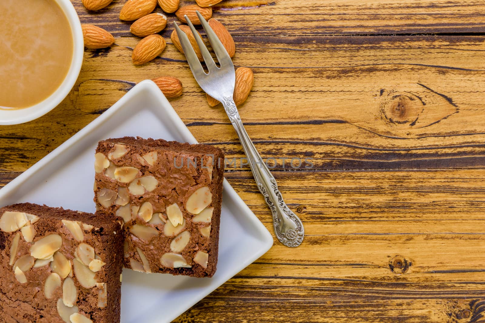 Chocolate almond brownie for relaxing coffee break.