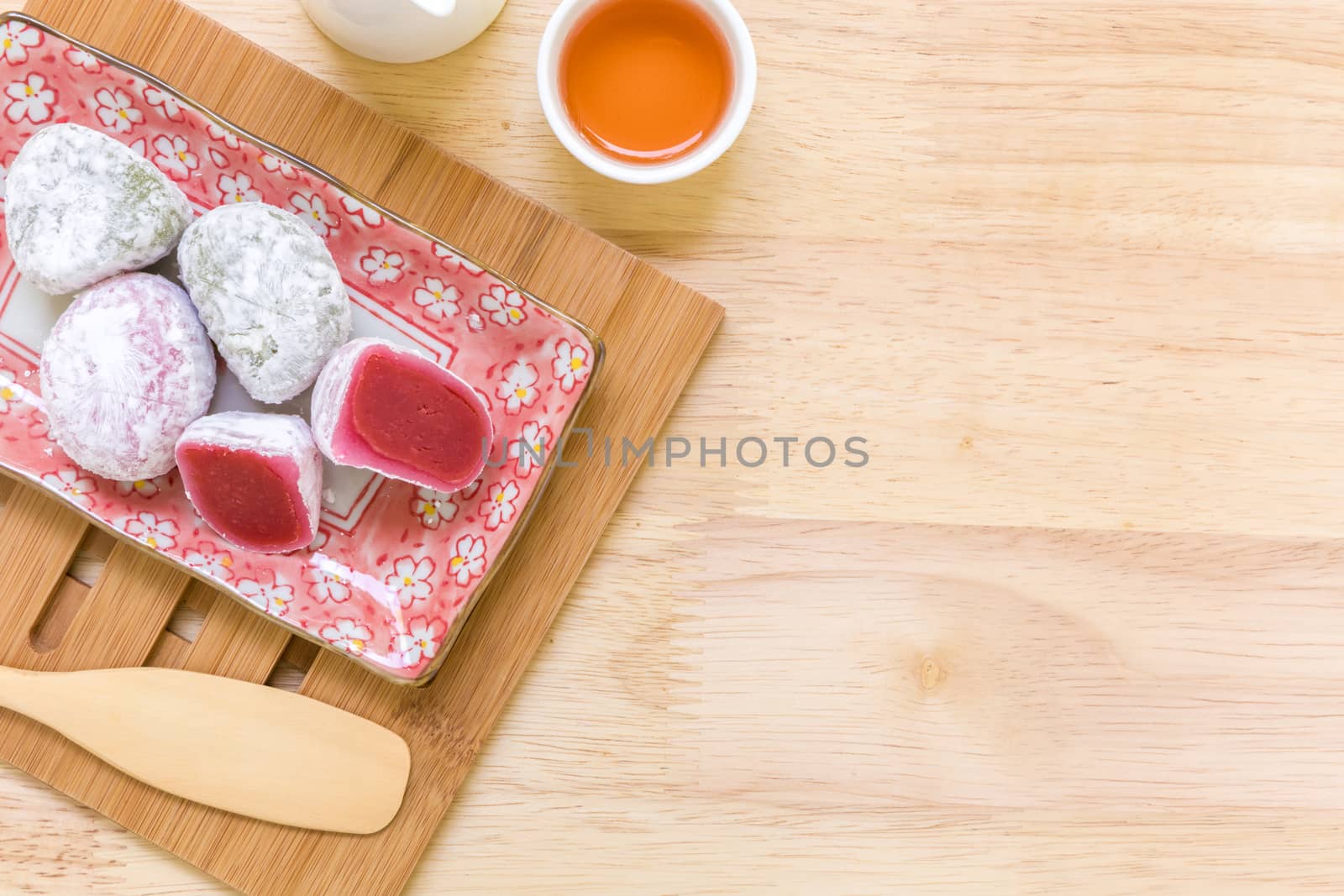 Daifuku traditional Japanese dessert eaten with tea background.