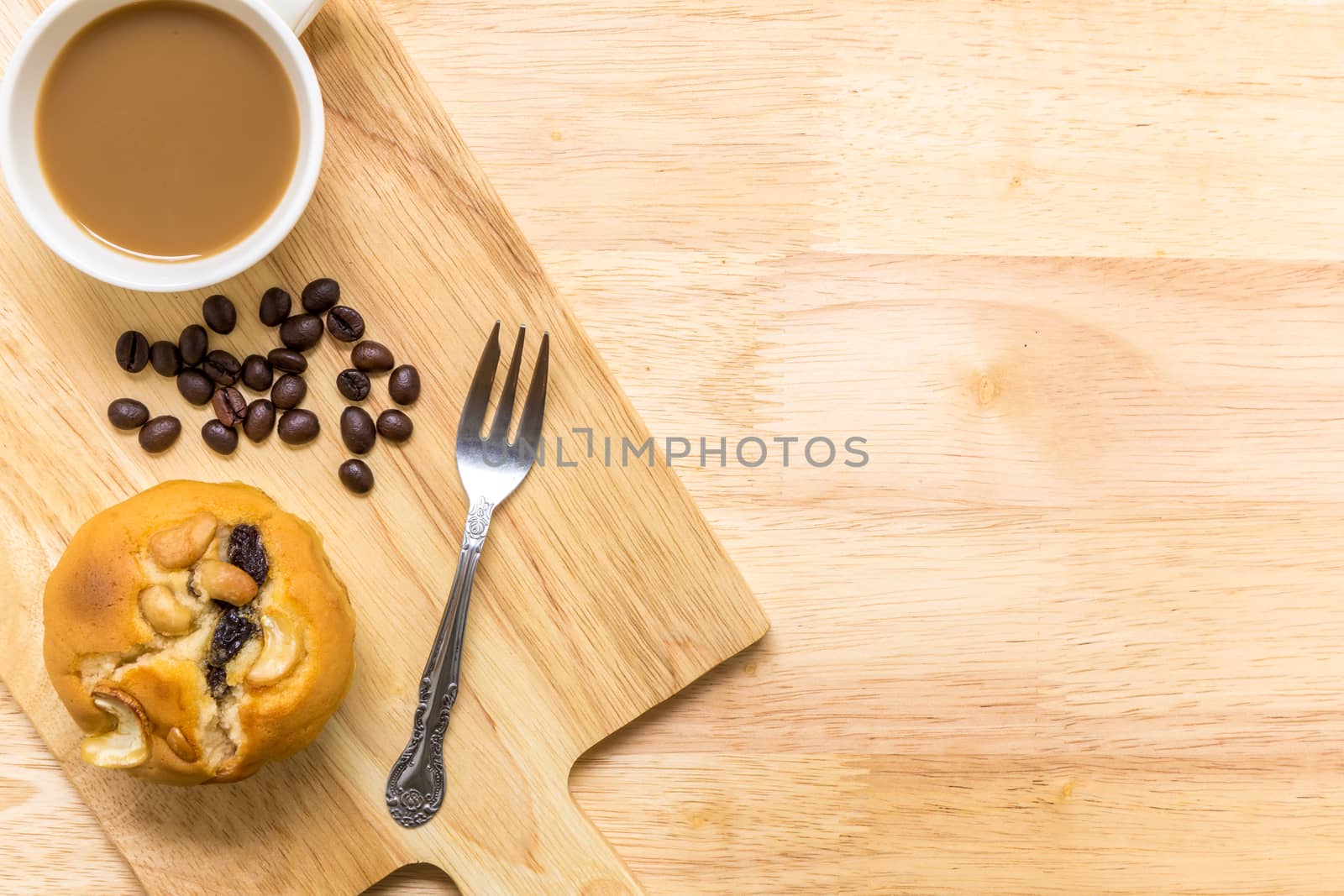 Homemade muffin for breakfast eaten with coffee.