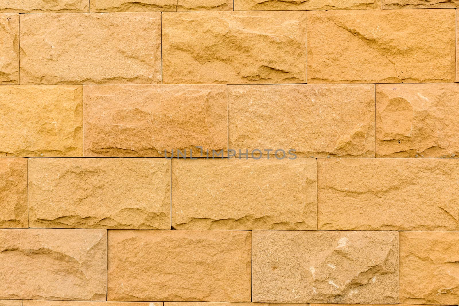 Close-up shot of stone brick wall revealing texture and detail.